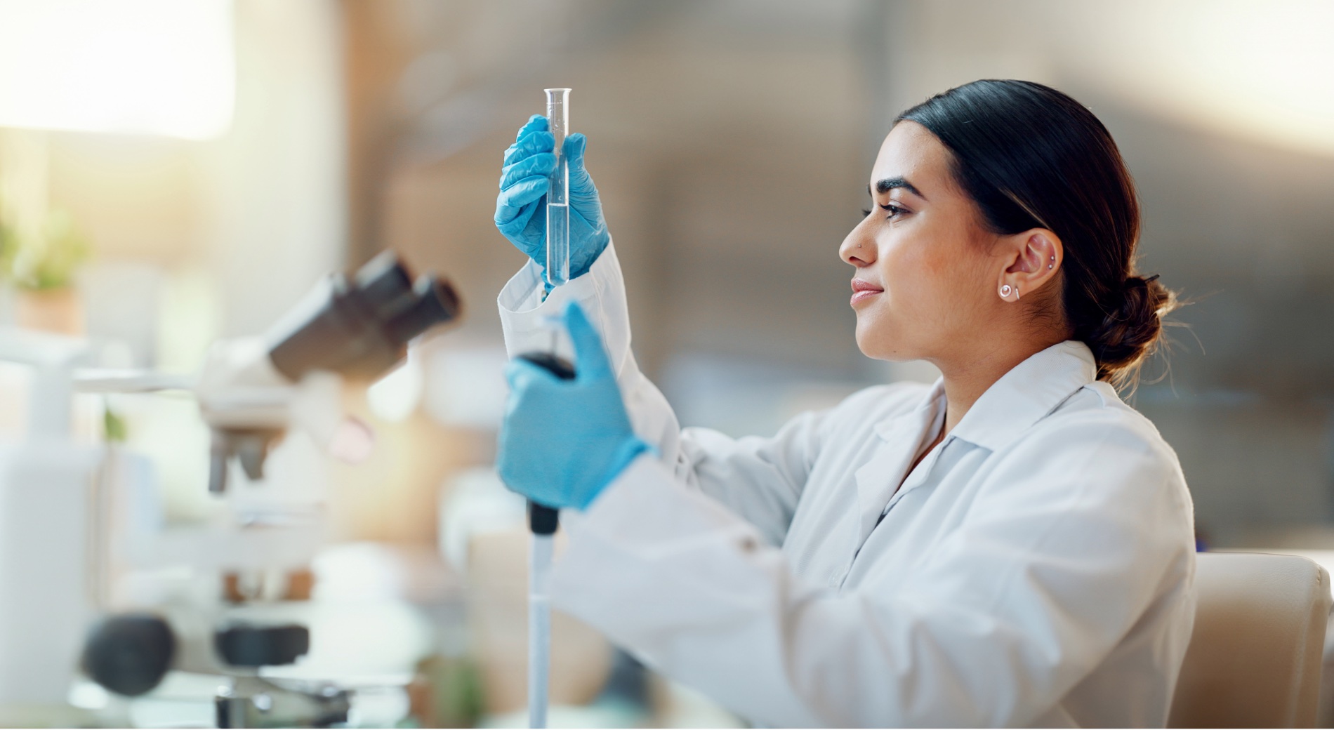 Laboratory scientist analysing a clear water sample